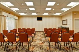 a conference room with a bunch of chairs and a podium at Homewood Suites by Hilton Woodbridge in Woodbridge +29 photos