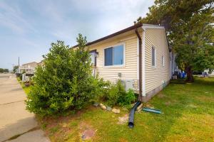 a small house with a tree next to it at AL-BE Vacation Villas # 5 in Ocean City