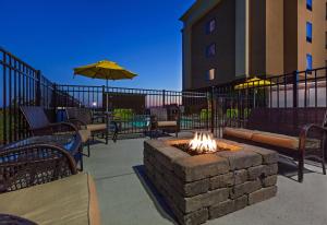 a fire pit in the middle of a patio at Hampton Inn Marion in Marion
