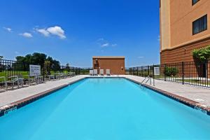 a large swimming pool in front of a building at Hampton Inn Marion in Marion