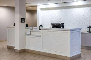 a lobby with a counter with a phone on it at Hilton Garden Inn Roanoke in Roanoke +41 photos