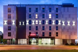 a rendering of a building at night at Hampton by Hilton Krakow in Kraków