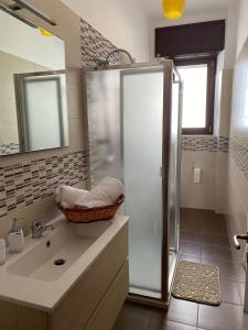 a bathroom with a shower and a sink at Casangiù in Crispiano