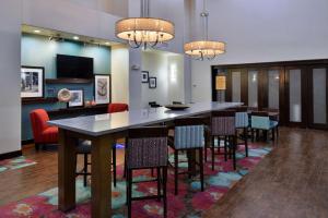 a dining room with a large table and chairs at Hampton Inn and Suites Hutto in Hutto