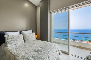 Postel nebo postele na pokoji v ubytování Penthouse Gardenias