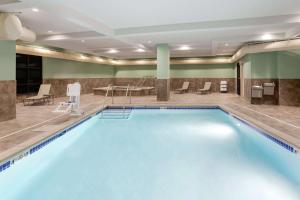 a large swimming pool in a hotel room at Hampton Inn & Suites West Des Moines Mill Civic in West Des Moines