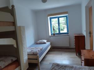 Postel nebo postele na pokoji v ubytování U Koupaliště