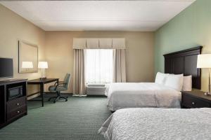 a hotel room with two beds and a desk at Hampton Inn & Suites Mount Joy/Lancaster West, Pa in Manheim +20 photos