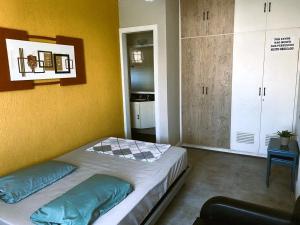 Postel nebo postele na pokoji v ubytování Triplex Astúrias - Guarujá + 9 fotografií