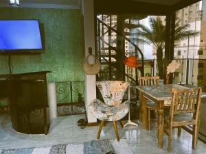 Posezení v ubytování Triplex Astúrias - Guarujá