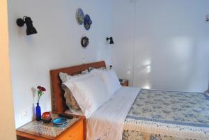 Postel nebo postele na pokoji v ubytování Giaglakis Rooms