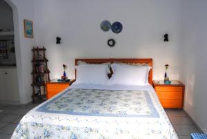 Postel nebo postele na pokoji v ubytování Giaglakis Rooms