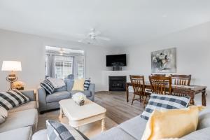 a living room with a couch and a table at Bethany Breeze --- 38424 Driftwood Ct #629 in Frankford