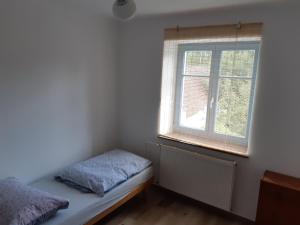 Postel nebo postele na pokoji v ubytování U Koupaliště