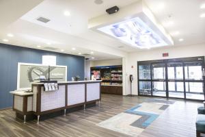 a lobby of a store with a large skylight at Hampton Inn Toledo Oregon in Oregon +30 photos