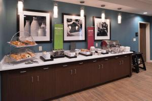 a bakery counter with a buffet of food at Hampton Inn Leavenworth in Leavenworth