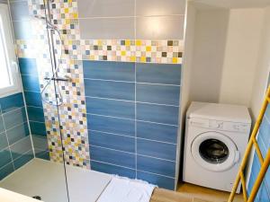 Ванная комната в Charmant appartement, T2 50m2, à Biguglia