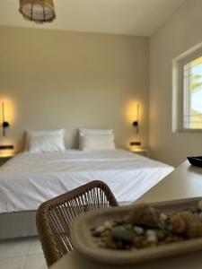 a bedroom with a bed and a table with a plate of food at Electra Studios in Palaiochora