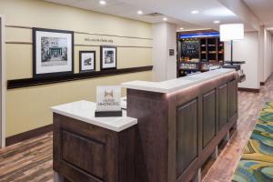 a bar in a wine tasting room with a wine cellar at Hampton Inn & Suites Sioux City South, IA in Sioux City