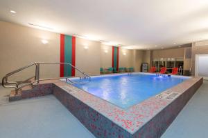 a large swimming pool in a building at Home2 Suites by Hilton Indianapolis Downtown in Indianapolis