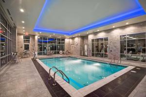 a swimming pool in a large building with a swimming pool at Homewood Suites by Hilton Nashville Franklin in Franklin