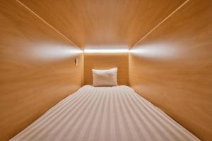 Postel nebo postele na pokoji v ubytování Parc Avenue Hostel