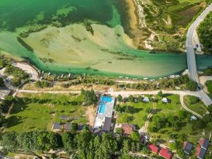 an aerial view of a park next to the water at Sunny Resort in Donji Karin