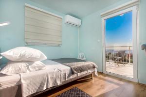 Ένα ή περισσότερα κρεβάτια σε δωμάτιο στο Vila Marula +59 φωτογραφίες