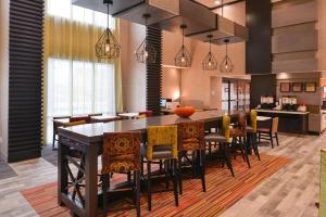 a large dining room with a large table and chairs at Hampton Inn and Suites Ames, IA in Ames