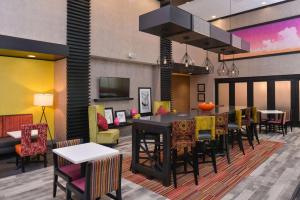 a dining room with a table and chairs at Hampton Inn and Suites Ames, IA in Ames