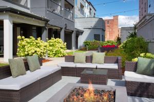 a patio with couches and a fire pit at Hampton Inn & Suites-Worcester, MA in Worcester