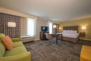 a hotel room with a bed and a desk at Hampton Inn Waynesboro in Waynesboro