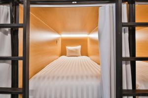 Postel nebo postele na pokoji v ubytování Parc Avenue Hostel