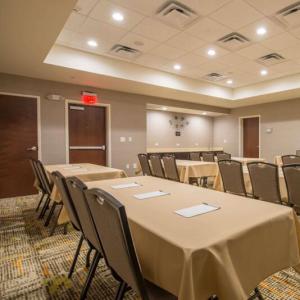 a conference room with tables and chairs in it at Hampton Inn Waynesboro in Waynesboro