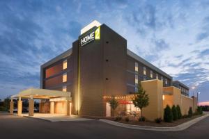 a dmg building with a dmg sign on it at Home2 Suites by Hilton Milwaukee Brookfield in Waukesha