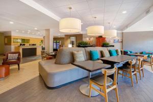 a living room with a couch and a table at Home2 Suites By Hilton Waco in Waco