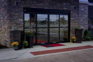 a front door of a building with flowers in it at Hampton Inn & Suites By Hilton Hammond, In in Hammond