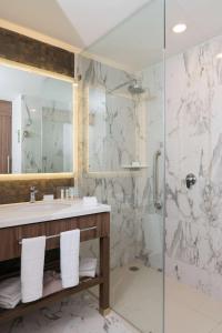 a bathroom with a sink and a shower at Hampton Inn by Hilton Irapuato in Irapuato