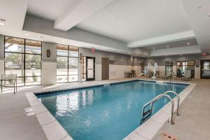 a large swimming pool in a hotel room at Hampton Inn & Suites Dallas-Central Expy/North Park Area in Dallas