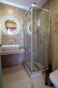 a bathroom with a shower and a sink at Haus Riviera in Asprovalta +11 photos