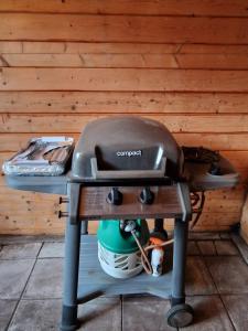 a grill sitting on top of a table at Chalet in Putten in Putten