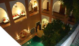 an overhead view of a building with a swimming pool at Riad Barroko in Marrakesh