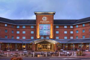 a hotel building with a sign on the front of it at Doubletree By Hilton Glasgow Strathclyde in Bellshill
