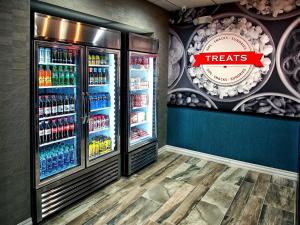 a grocery store with a refrigerator filled with drinks at Hampton Inn & Suites-Moore in Moore