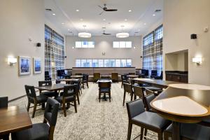 a large dining room with tables and chairs at Homewood Suites By Hilton Phoenix Tempe Asu Area in Tempe