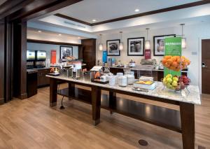 a restaurant with a buffet with fruit on a counter at Hampton Inn by Hilton New Paltz, NY in New Paltz