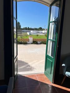 an open door with a view of a patio at Quinta da Varzea in Raposa