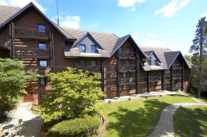 an exterior view of a large wooden building at DoubleTree by Hilton Southampton in Southampton