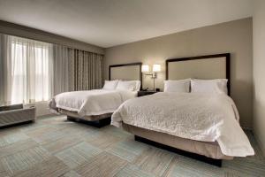 a hotel room with two beds and a window at Hampton Inn Yemassee/Point South, Sc in Yemassee +34 photos