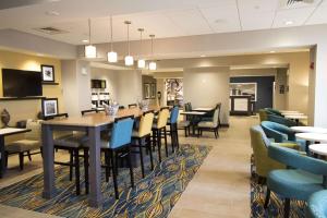 a dining room with a table and chairs at Hampton Inn Decatur, Mt. Zion, IL in Decatur